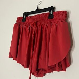 Red flowy athletic shorts